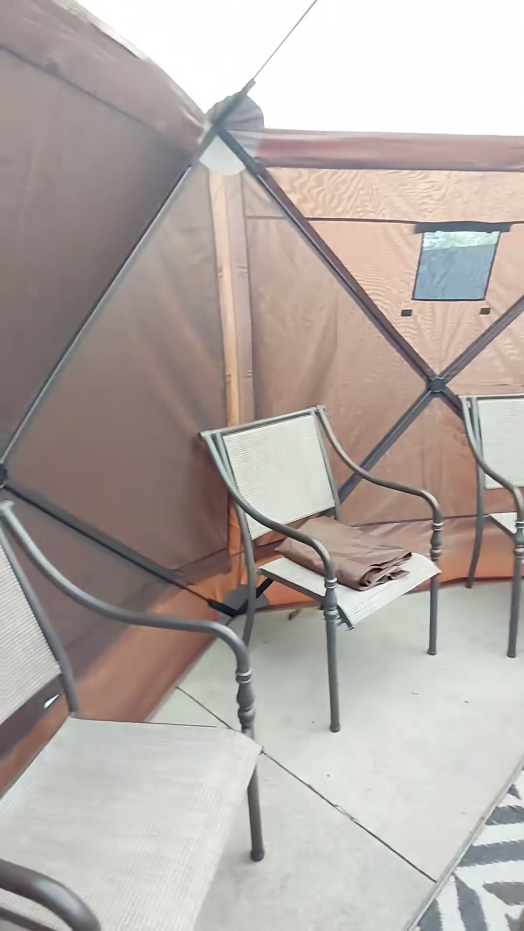 Roomy interior seating area inside the 12 x 12 ft screen tent